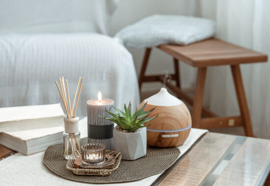 composition with incense sticks diffuser candles and books on the table in the interior of the room scaled 550x380 - Blog