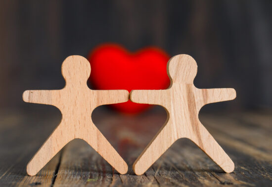 relationship concept with red heart wooden human figures on wooden table side view scaled 550x380 - Blog